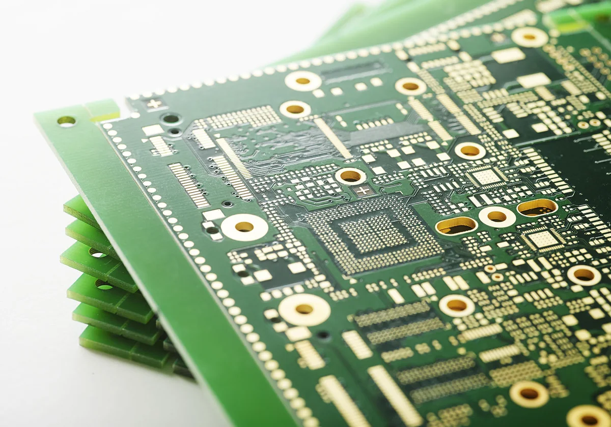 Stack of green multilayer FR-4 PCBs with BGA pads and ENIG finish, typical of boards built on Shengyi laminates